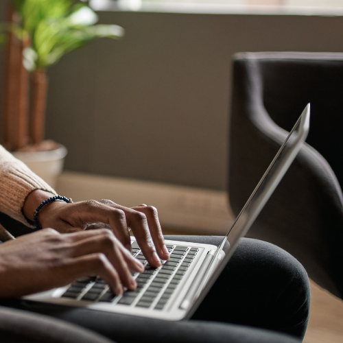 Man typing on laptop